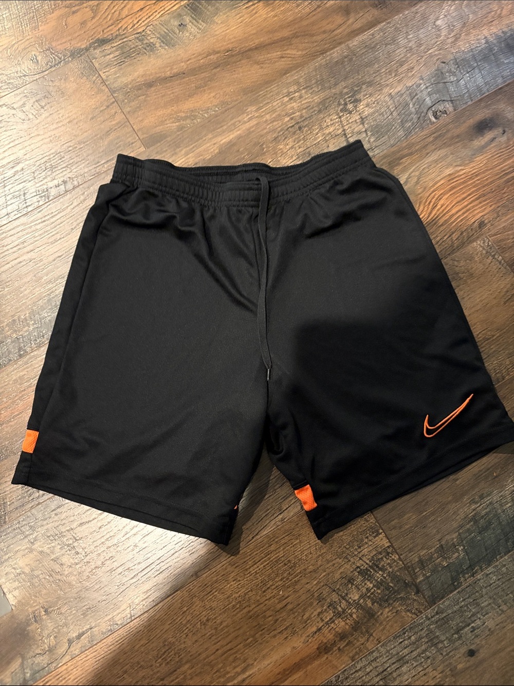 Nike Men’s Black Athletic Shorts with Orange Swoosh